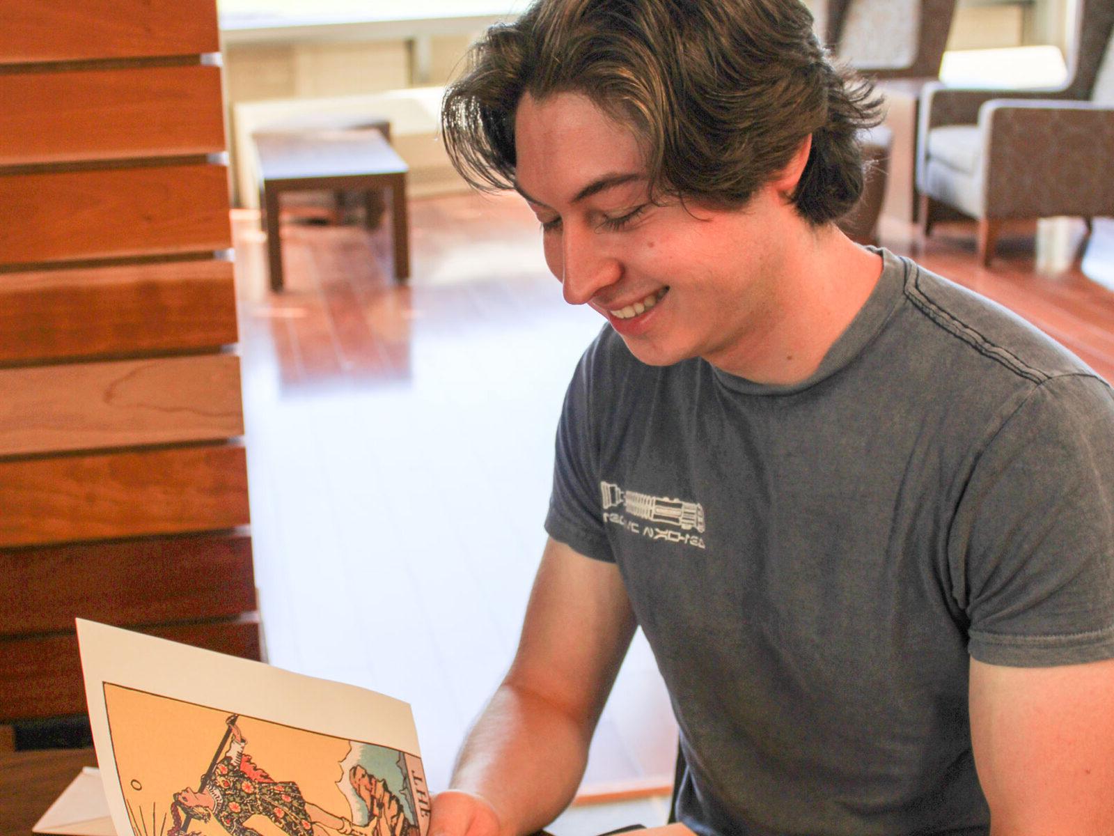 a man looking at a book